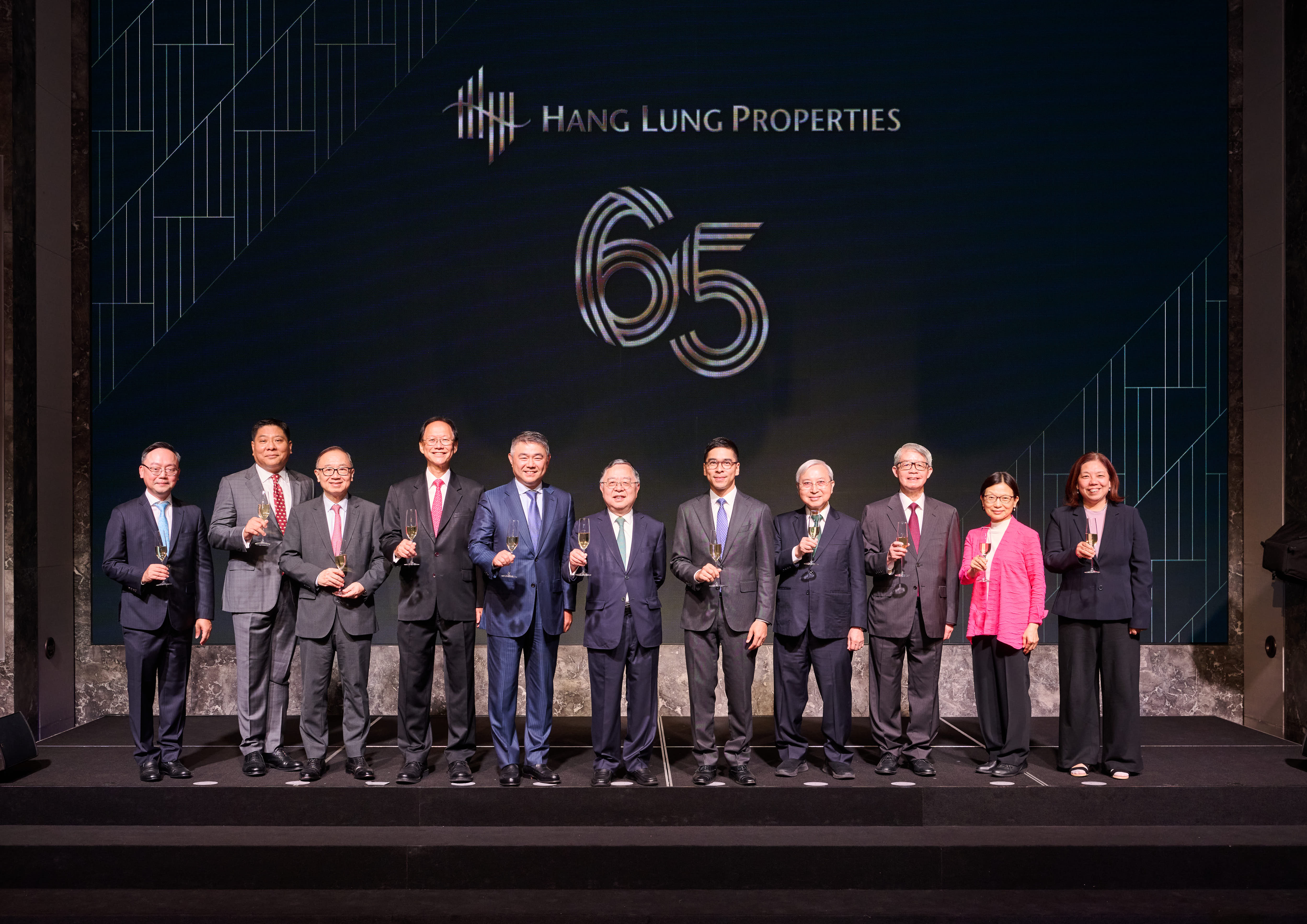 Hang Lungâ€™s Board of Directors marks the Groupâ€™s 65th anniversary with a celebratory toast. From left to right: Kenneth Chiu, Chief Financial Officer of Hang Lung Group and Hang Lung Properties, Roy Chen, Non-Executive Director of Hang Lung Group, Martin Liao, Independent Non-Executive Director of Hang Lung Group, Philip Chen, Independent Non-Executive Director of Hang Lung Properties, Weber Lo, Chief Executive Officer of Hang Lung Group and Hang Lung Properties, Ronnie Chan, Honorary Chair of Hang Lung Group and Hang Lung Properties, Prof. Pak Wai Liu, Independent Non-Executive Director of Hang Lung Group, Dr. Andrew Chan, Independent Non-Executive Director of Hang Lung Properties, Anita Fung, Independent Non-Executive Director of Hang Lung Properties, Holly Li, Independent Non-Executive Director of Hang Lung Properties