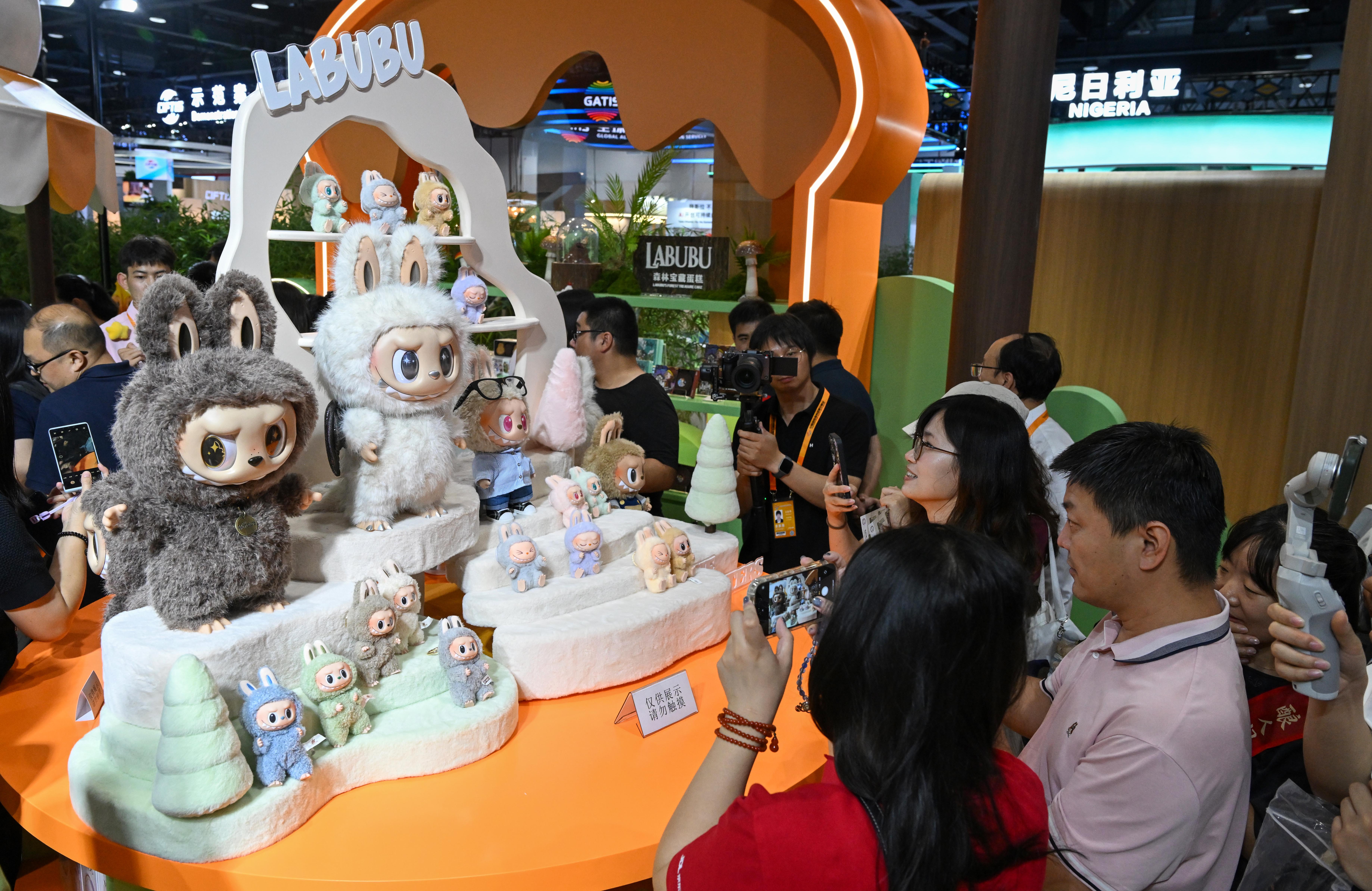 People visit a booth of Pop Mart during the 2025 China International Fair for Trade in Services (CIFTIS) in Beijing, capital of China, Sept. 10, 2025. (Xinhua/Chen Yehua)