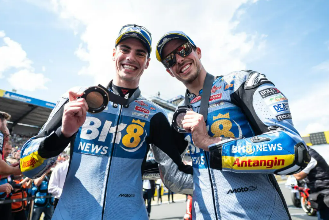 Álex Márquez on the left and Fermín Aldeguer on the right, on the podium after finishing second and third in the MotoGP Aragon 2025 Sprint Race at MotorLand Aragon Circuit, Spain. Photo courtesy of BK8 Gresini Racing MotoGP.