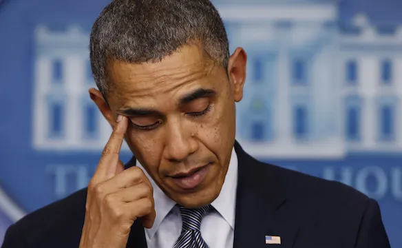 U.S. President Barack Obama wipes a tear as he speaks about the shooting at Sandy Hook Elementary School in Newtown during a press briefing at the White House in Washington