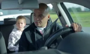 Father And Son Inside The Car