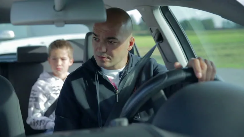 father and son inside the car