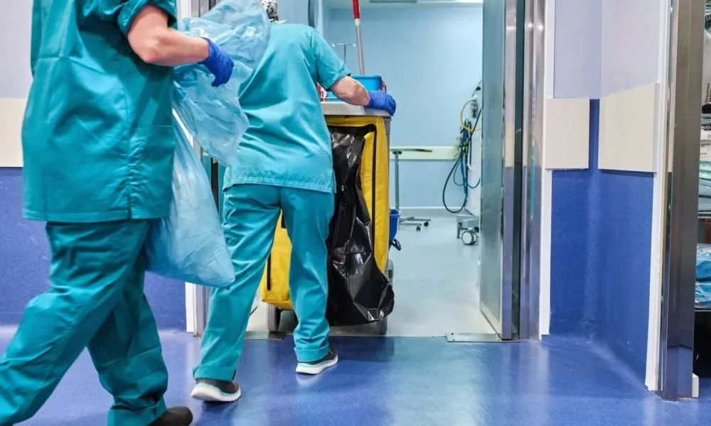 Hospital Cleaning Staff Enter An Operating Room With A Cleaning Cart 1536x1024 1
