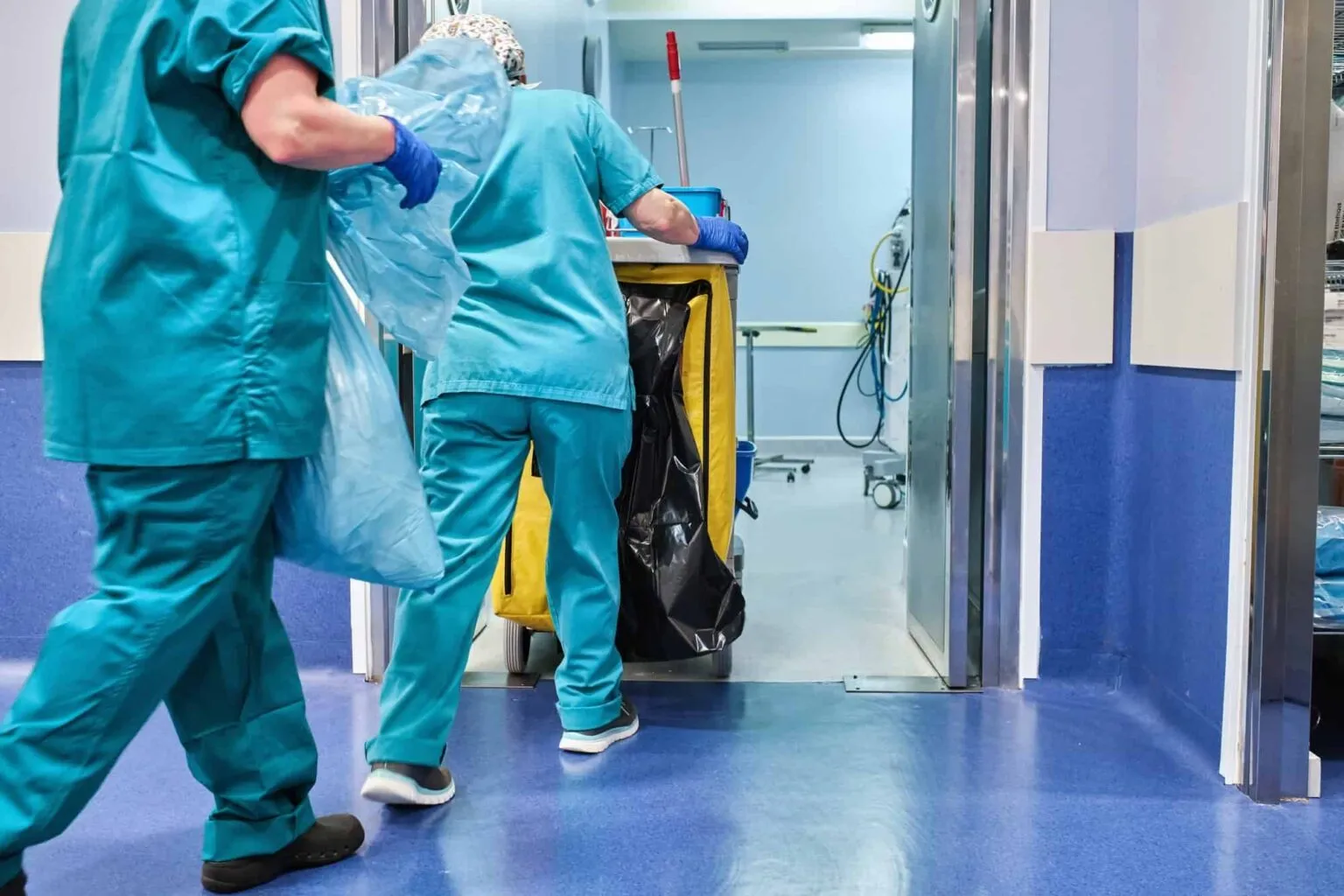 Hospital Cleaning Staff Enter An Operating Room With A Cleaning Cart 1536x1024 1