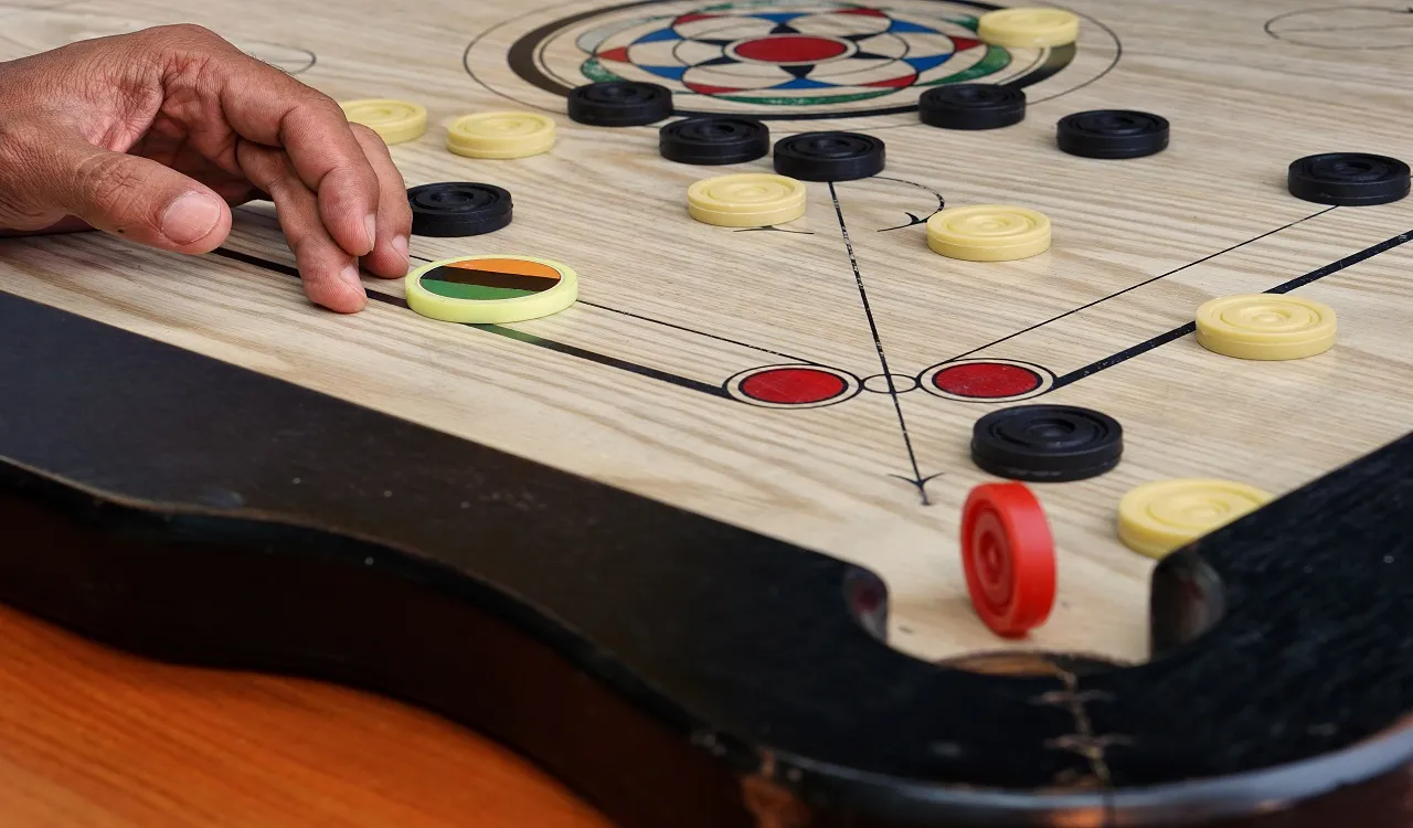 A,Game,Of,Carrom,With,Pieces,Carrom,Man,On,The