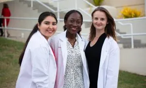 3 Female Students White Coats 2
