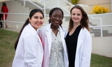 3 Female Students White Coats 2