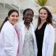 3 Female Students White Coats 2
