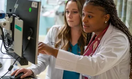 2 Female Students Checking Resul
